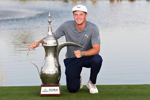 Bryson DeChambeau with the famous trophy after claiming the 30th Omega Dubai Desert Classic. Picture by GETTY IMAGES