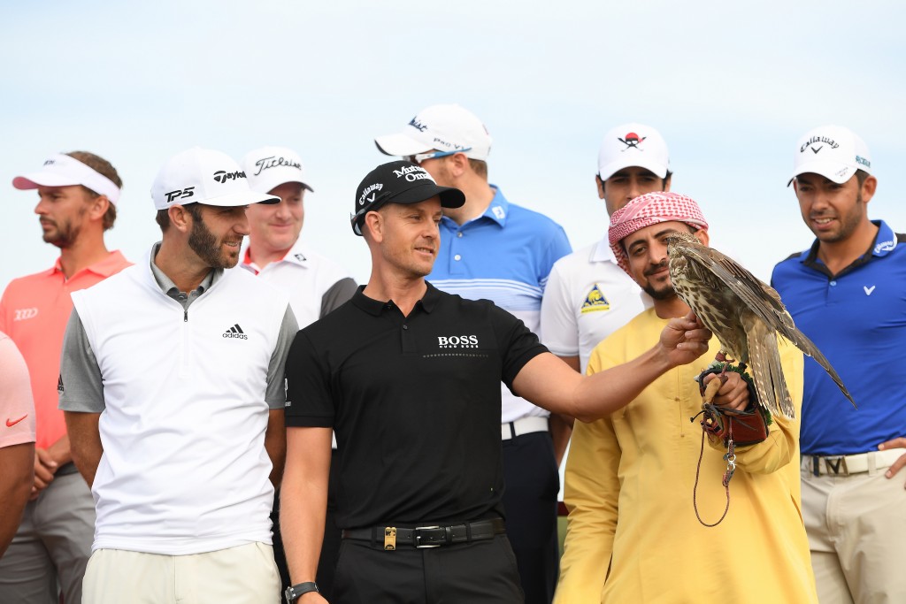Henrik Stenson gets up close to one of the falcons famed for in the Emirate state watched by Dustin Johnston (left) and other members of the European Tour ahead of this week’s Abu Dhabi HSBC Championship. Picture by GETTY IMAGES.