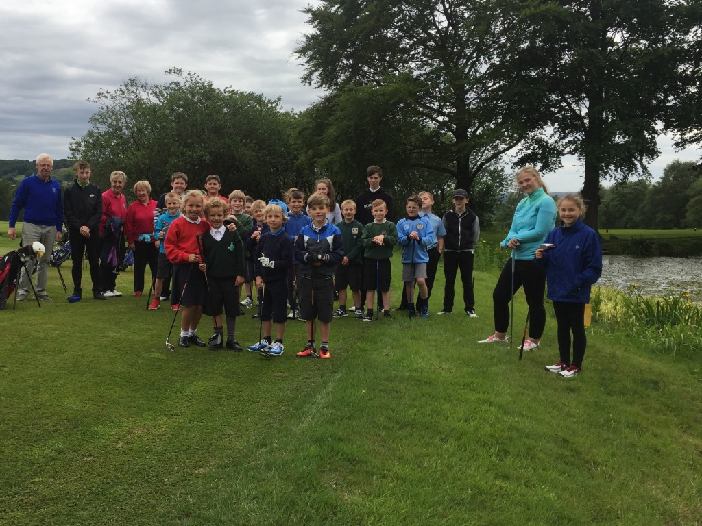 Youngsters at one of the weekly coaching sessions at Whalley Golf Club get ready for the Beat the Pond challenge.