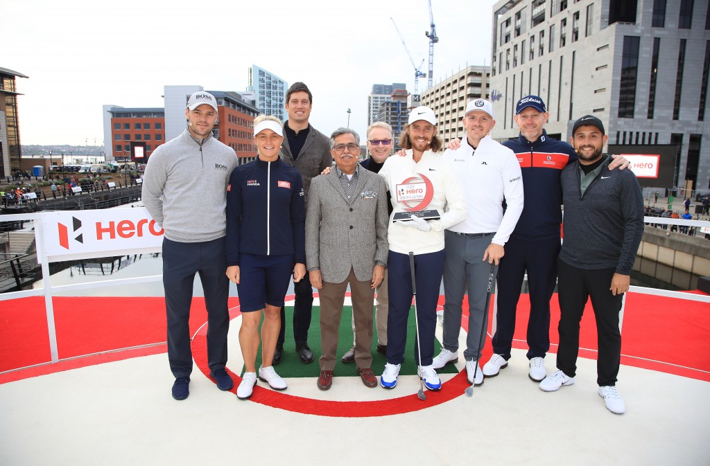 Tommy Fleetwood receives the Hero Challenge from chief executive Pawan Munjal (right). Picture by GETTY IMAGES