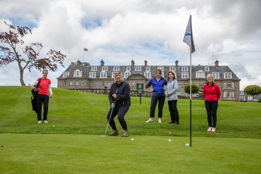 love.golf guests enjoy their introduction to golf, in sight of the iconic Gleneagles Hotel. Image credit Kenny Smith