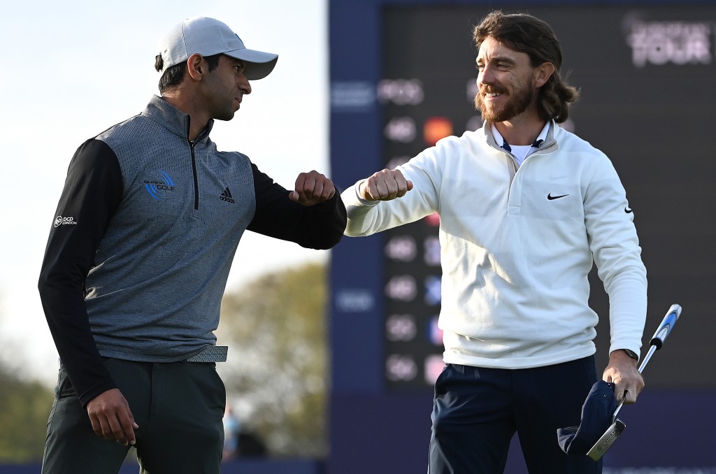Tommy Fleetwood congratulates Aaron Rai on his first Rolex Series win after a play-off in the 2020 Aberdeen Standard Investments Scottish Open
