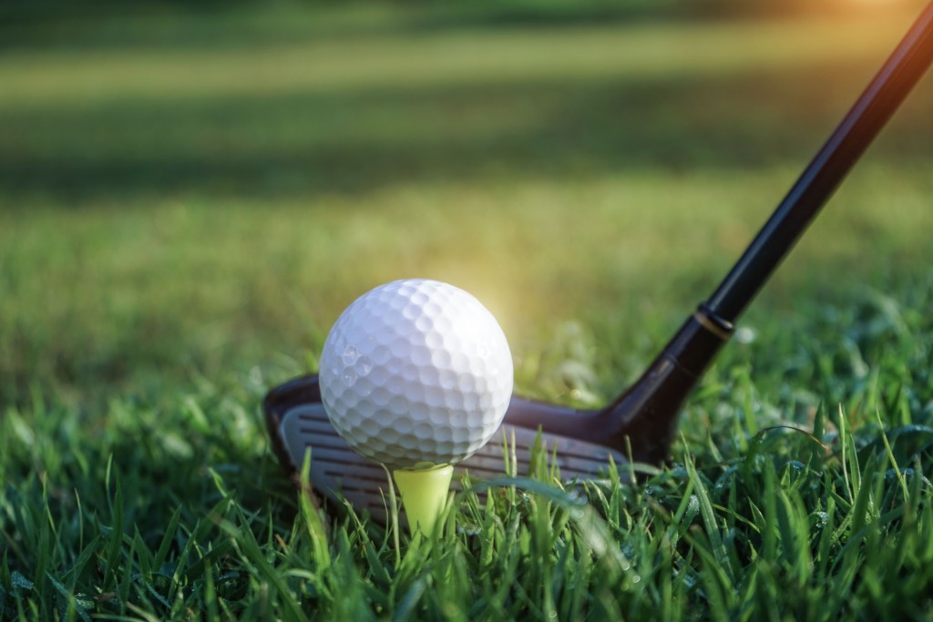 Golf,Club,And,Golf,Ball,Close,Up,In,Grass,Field